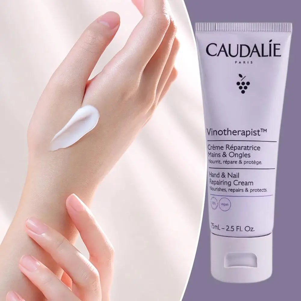Caudélé hand cream being applied to a hand with a visible tube of the product.