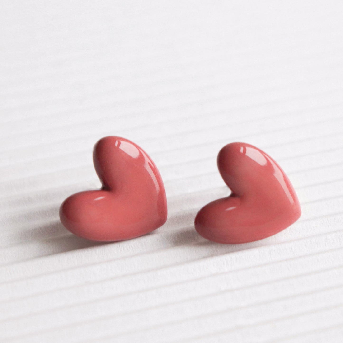 Porcelain Heart Studs -  Pink-Close-up of 925 sterling silver heart-shaped stud earrings