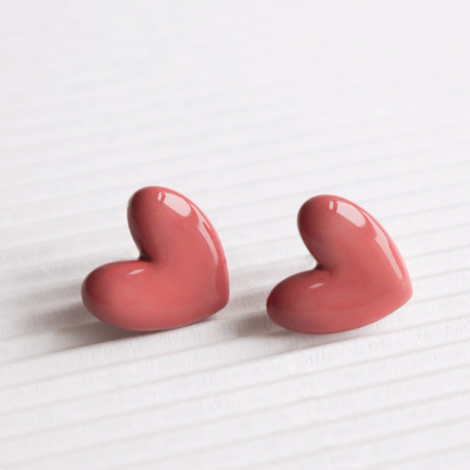 Porcelain Heart Studs -  Pink-Close-up of 925 sterling silver heart-shaped stud earrings
